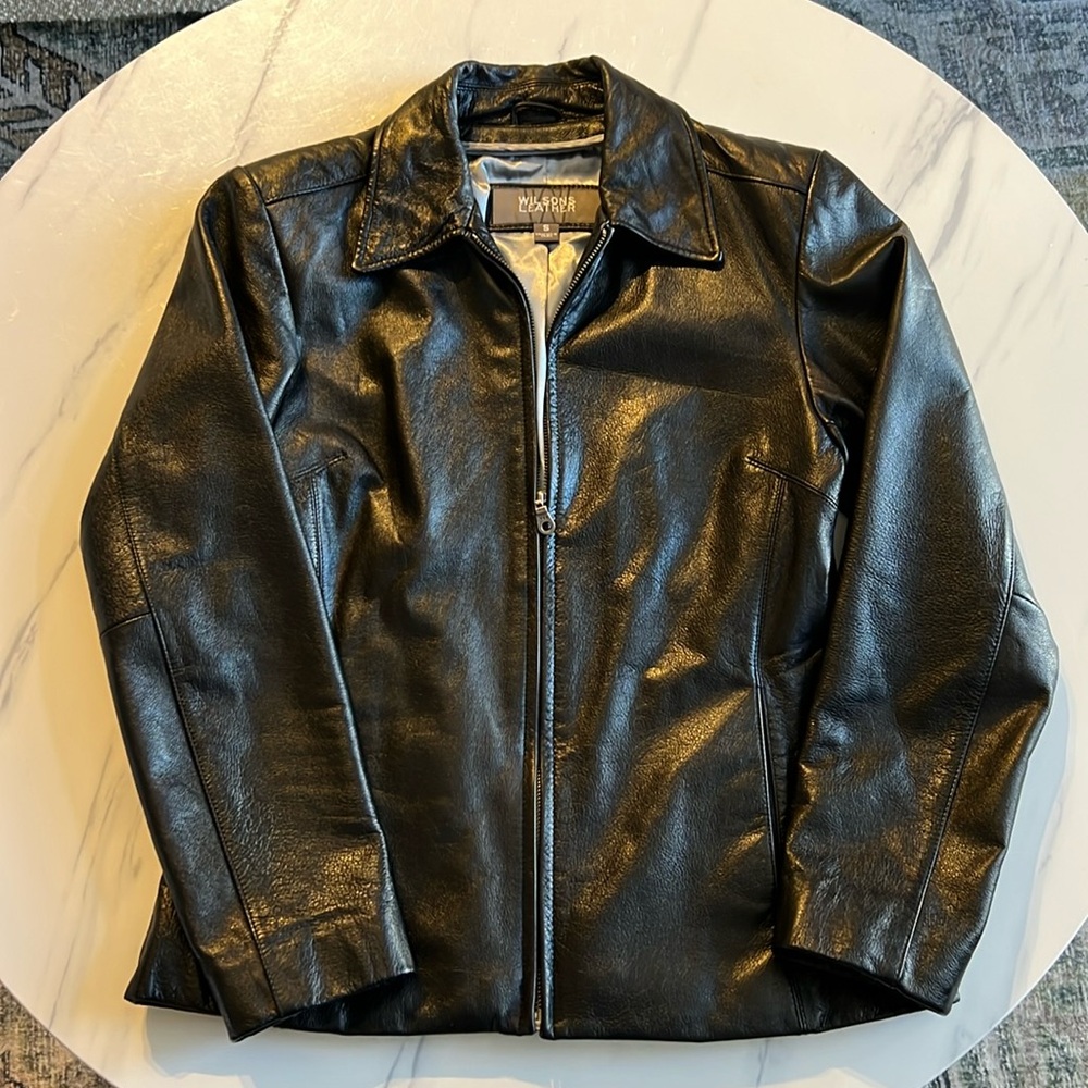 Fitted black leather jacket.